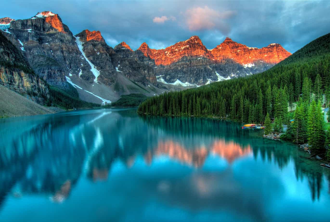 plan a road trip like this one in alberta amazing attraction banff mountain reflecting alpine glow onto pristine blue lake