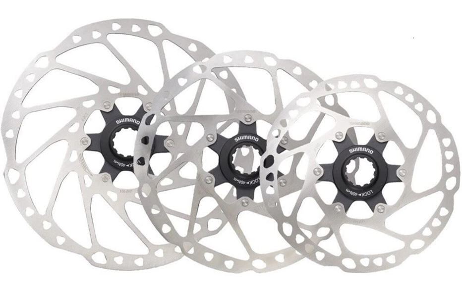 Electric Bikes For Newbies - Shop for the right bike (2023) 23 a display of different sizes of disk brake rotors