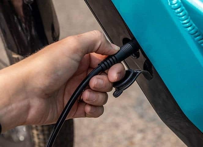 Electric Bikes For Newbies - Shop for the right bike (2023) 25 A display of an electric bike being charged